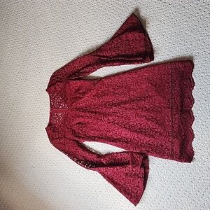A burgundy lace dress that only wore once. It's in perfect condition.